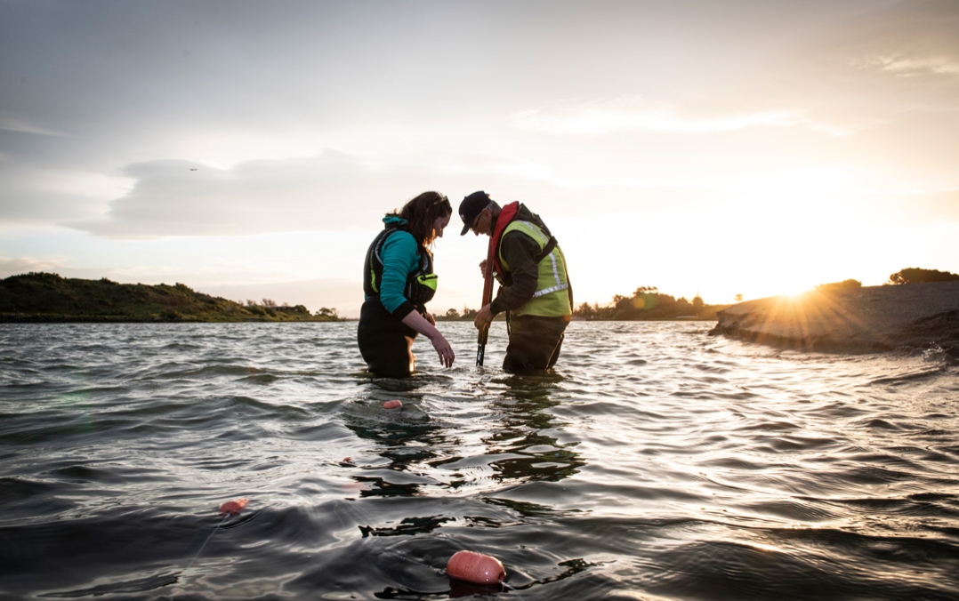 Eimear Egan sampling for glass eels in the Rangitaiki River, Thornton Beach. [Photo: Rebekah Parsons-King, NIWA]